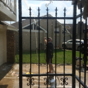 Wes pressure washing the house. An essential home task, I felt.